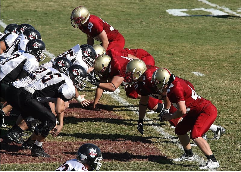 Two football teams inside the field