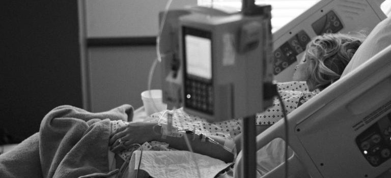 Woman in hospital bed